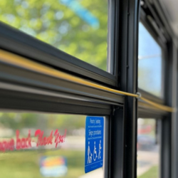 A yellow pull cord on a DRT bus